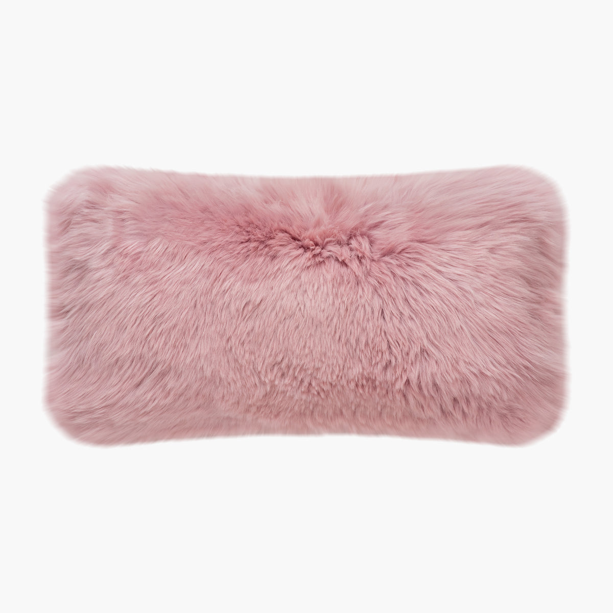 The Mood Charlie Sheepskin Double-sided Lumbar Pillow in a pastel pink color, on a white background, front view