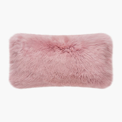 The Mood Charlie Sheepskin Double-sided Lumbar Pillow in a pastel pink color, on a white background, front view