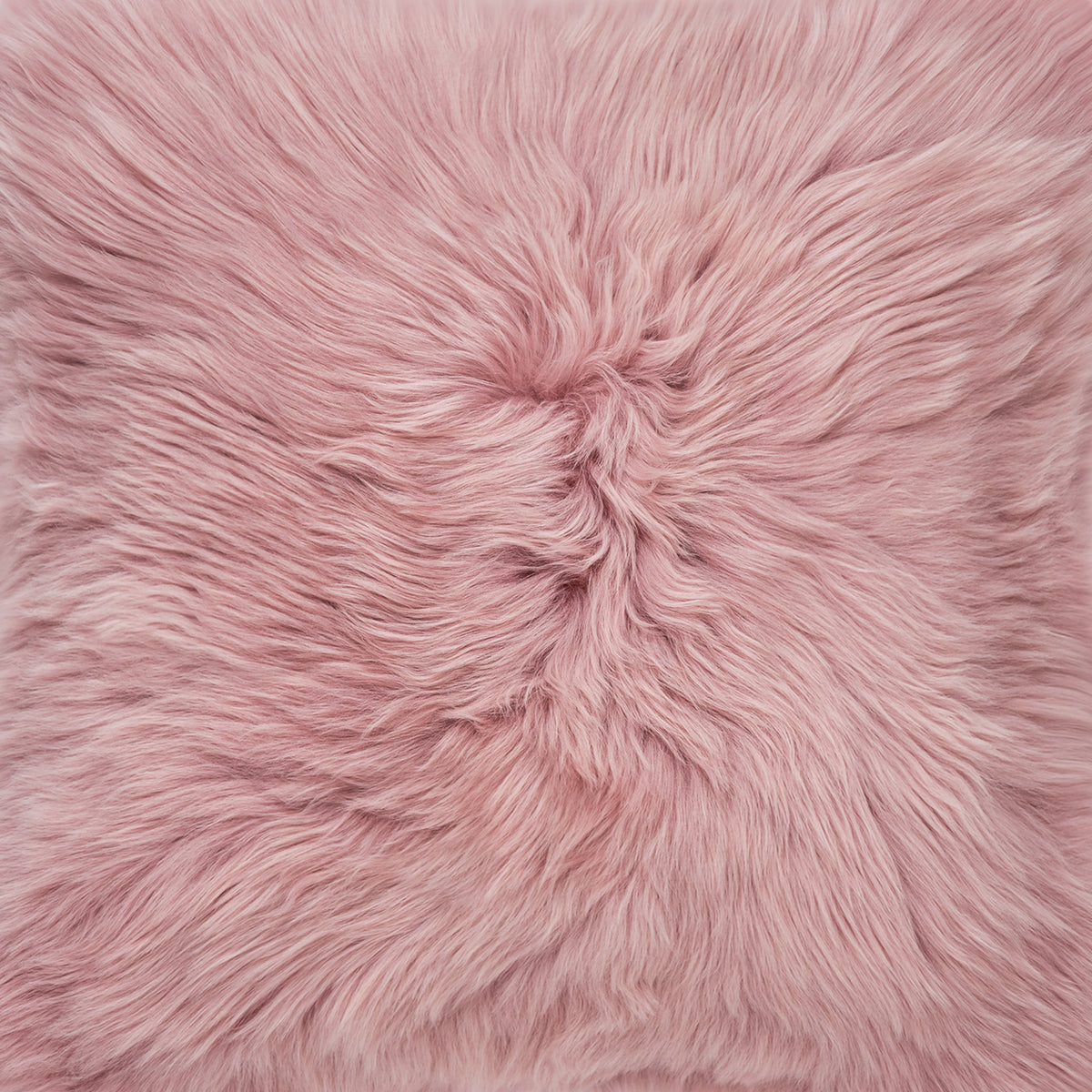 The Mood Charlie Sheepskin in a pastel pink color, color swatch