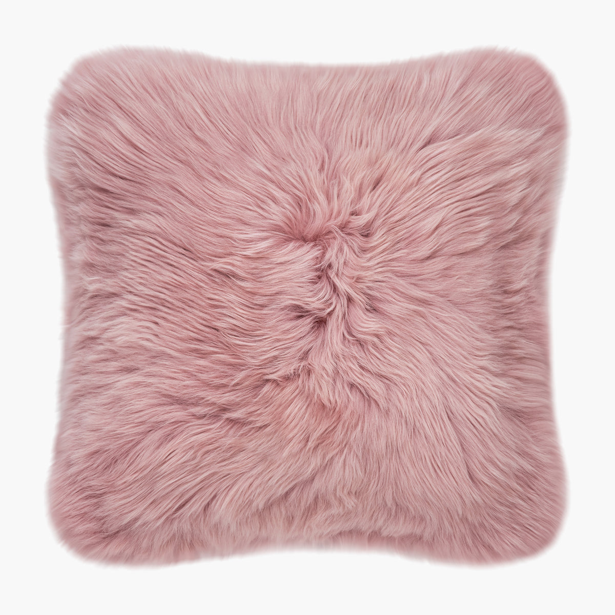 The Mood Charlie Sheepskin Double-sided Square Pillow in a pastel pink color, on a white background, front view