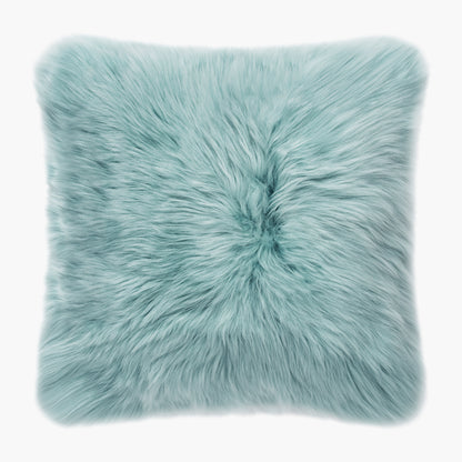 The Mood Charlie Sheepskin Double-sided Square Pillow in a pastel blue color, on a white background, front view