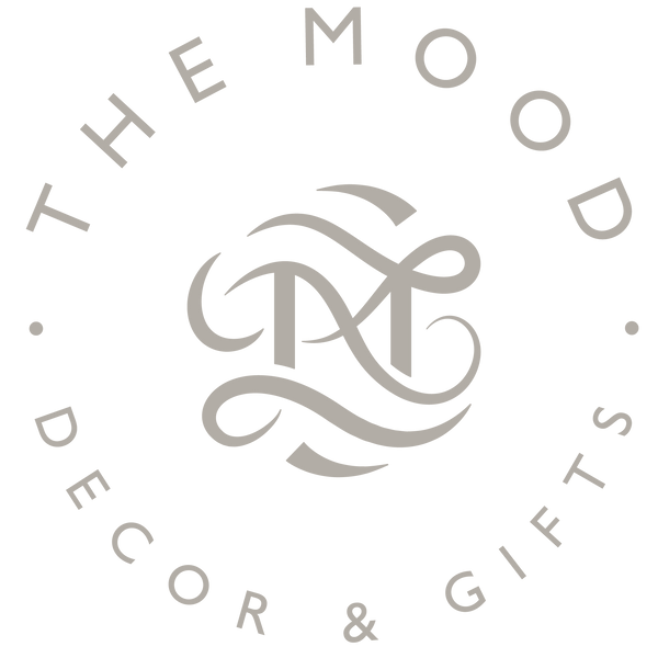 Logo of The Mood Decor & Gifts in off-white on a transparent background